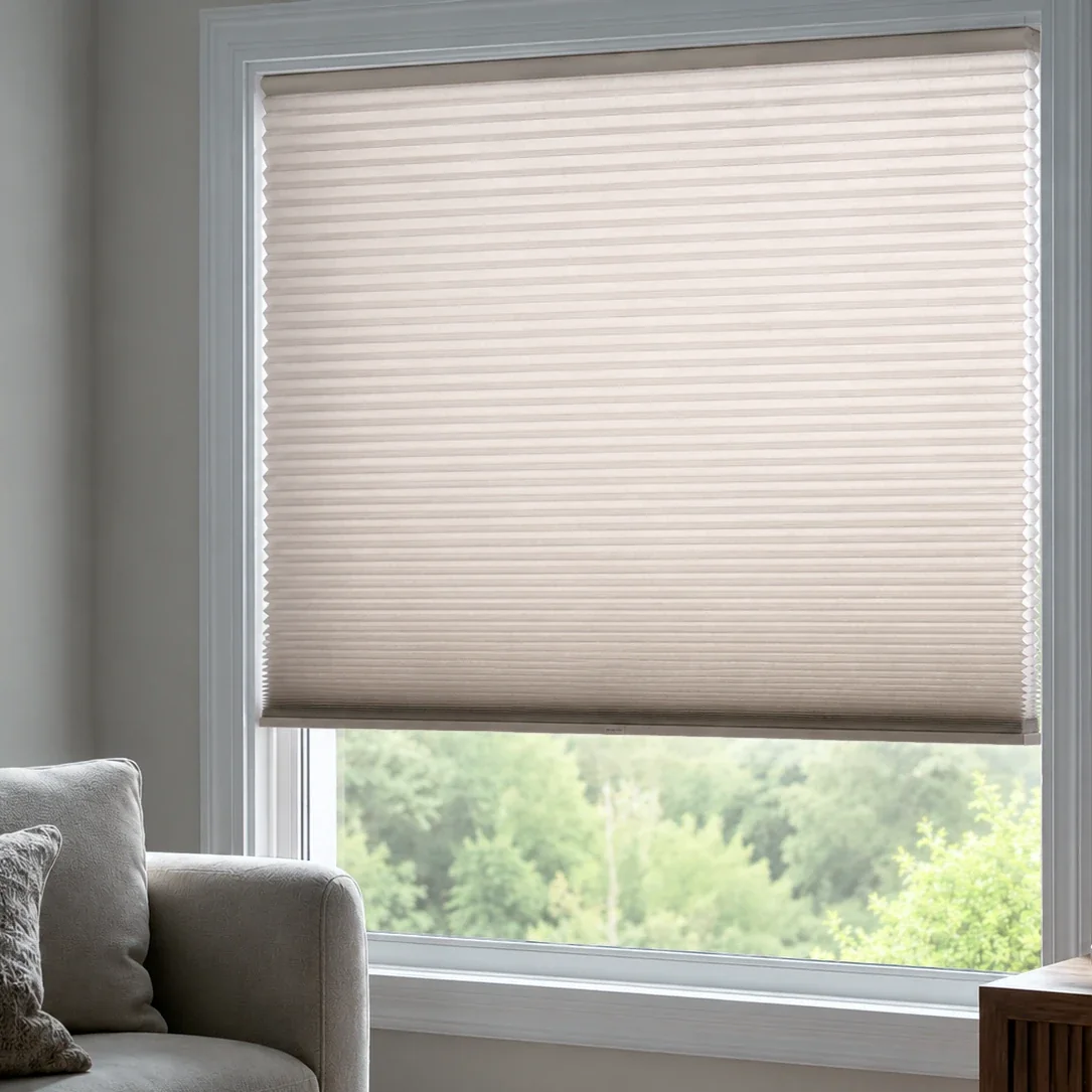 A honeycomb blind filtering daylight.