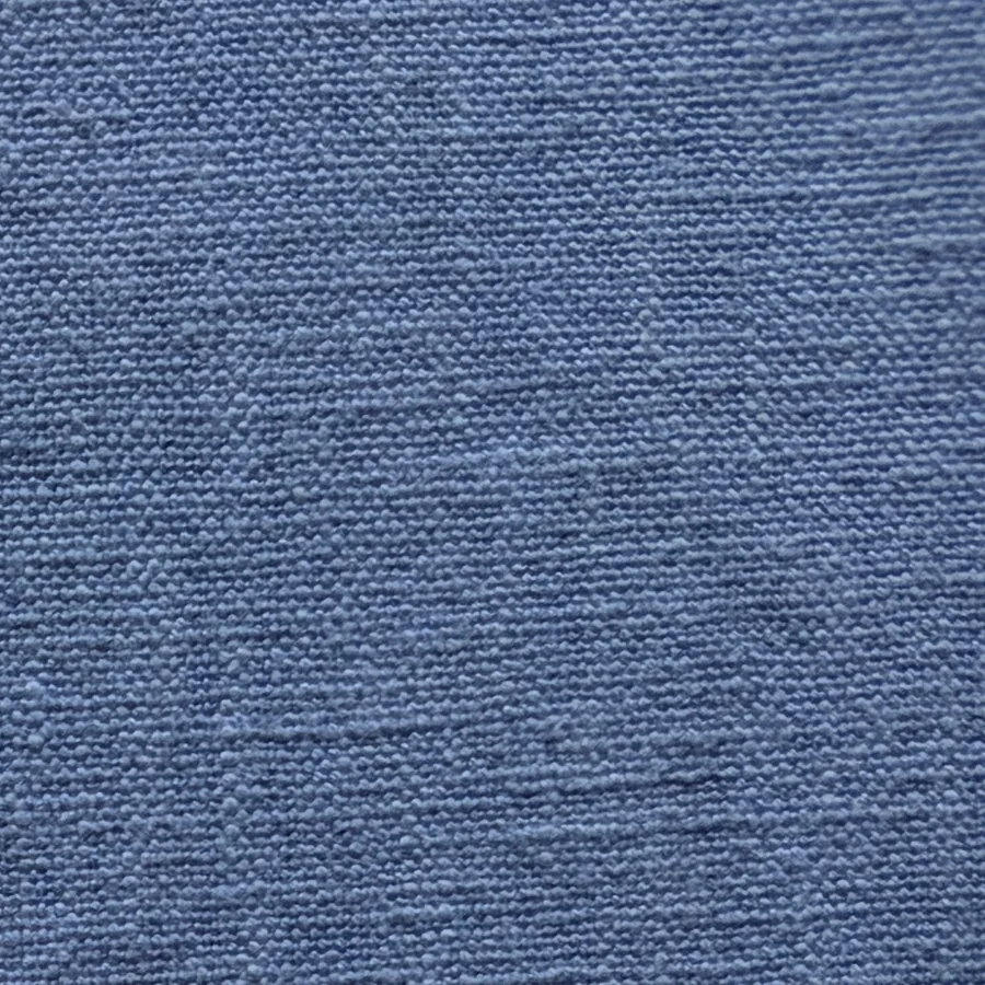 Slate-blue linen seen close enough to read its weave.