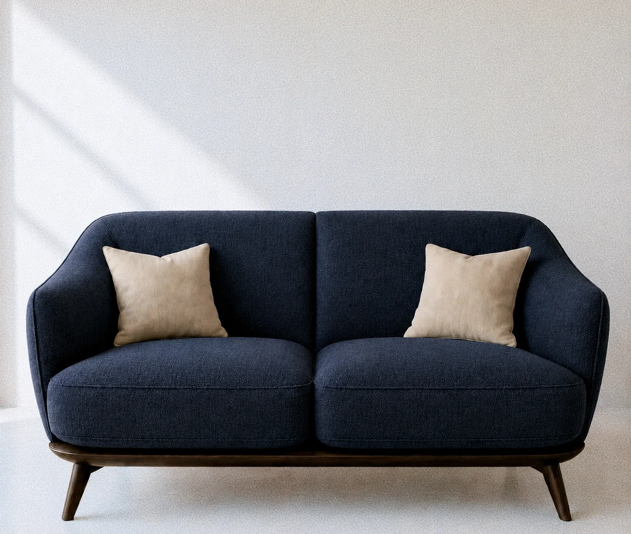The same sofa frame in deep indigo cloth.